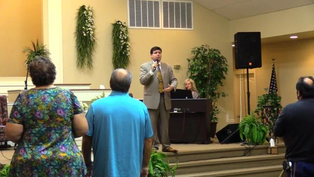 Pastor Vaughn prays a prayer of blessing after singing a song written by the late Ruth Heflin